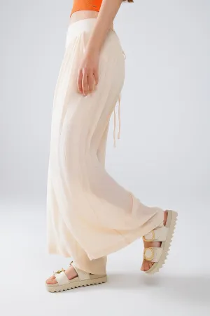 Beige Palazzo Style Pants With Side Pockets And Thick Waist Band